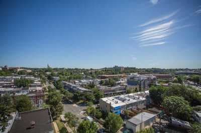 an aerial view of a city with trees and buildings